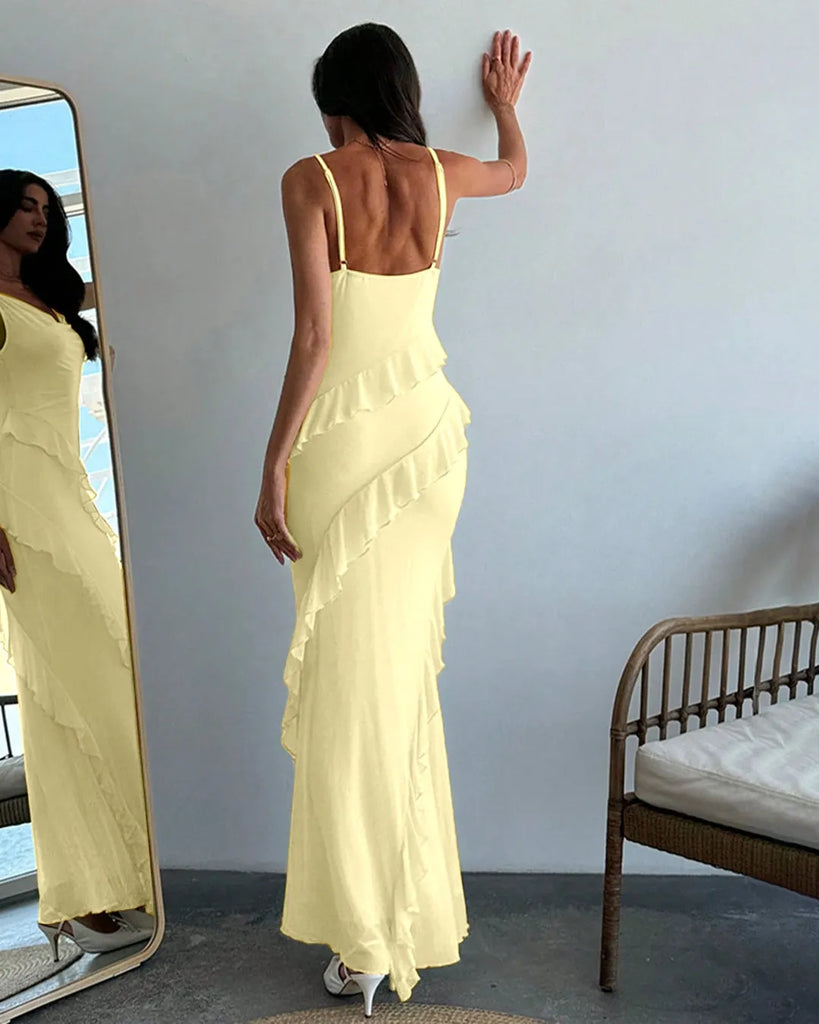 A French vanilla dress featuring delicate ruffle details and spaghetti straps for a soft, feminine touch.