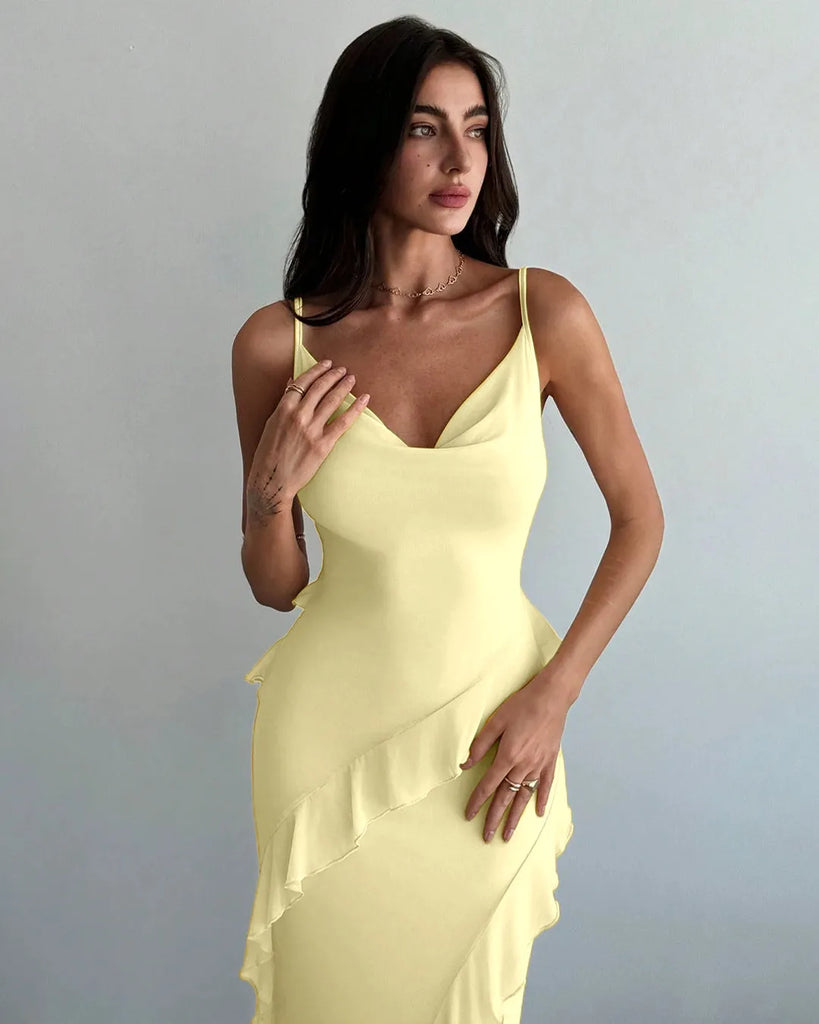 A French vanilla dress featuring delicate ruffle details and spaghetti straps for a soft, feminine touch.