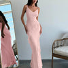 A light pink maxi dress featuring delicate ruffle details and spaghetti straps for a soft, feminine touch.
