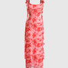 A baby pink bodycon maxi dress featuring ruffled sleeves and a delicate floral print.