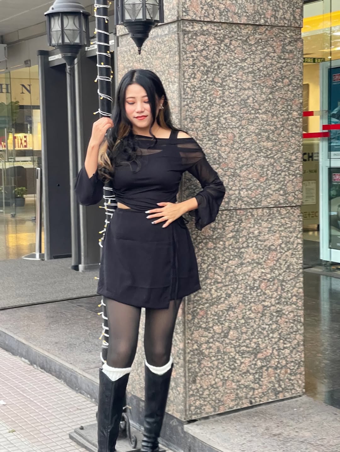 Customer photo 2 of Solid Color Knot Side Wrap Mini Skirt in Black