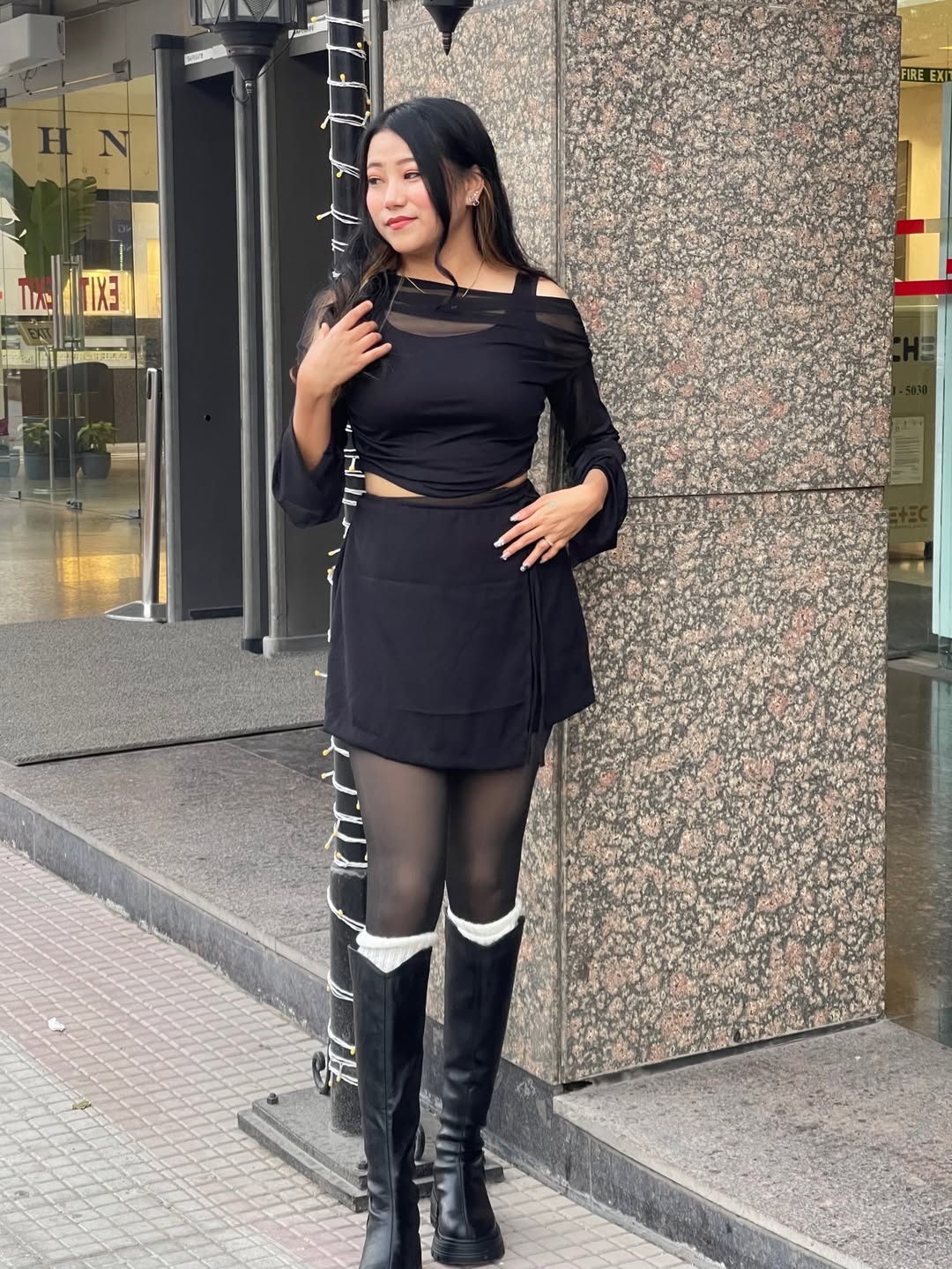 Customer photo 3 of Solid Color Knot Side Wrap Mini Skirt in Black