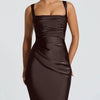 Women wearing coffee brown sleeveless fitted maxi dress with wide straps and a sleek body-hugging silhouette for an elegant party look