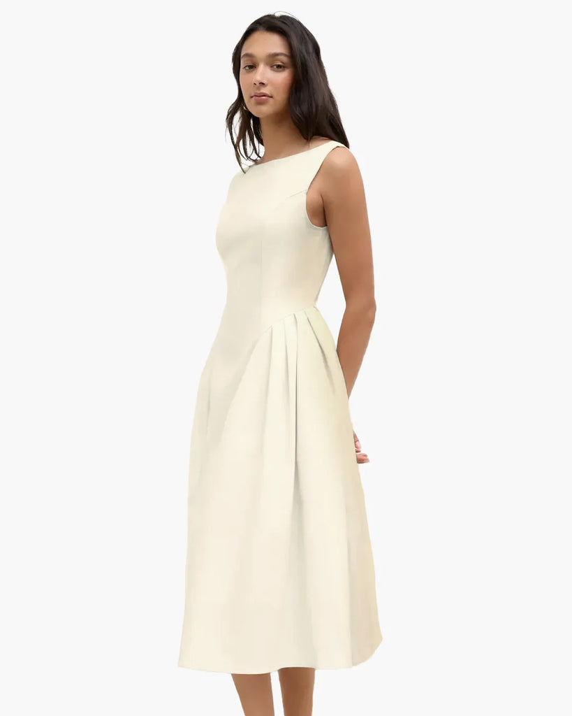 Sleeveless beige flared midi dress with a soft and flowy shape, ideal for daytime outings or casual events