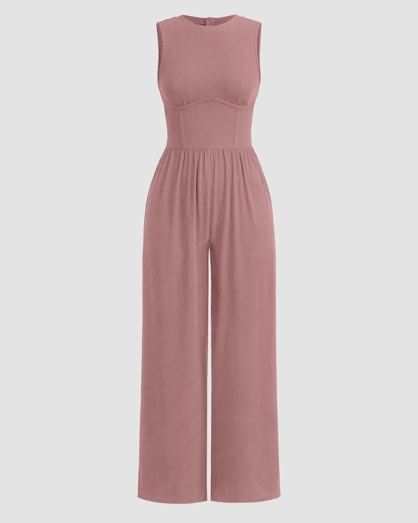 Dusty pink sleeveless jumpsuit with gathered waist and wide legs, made from soft, lightweight fabric.
