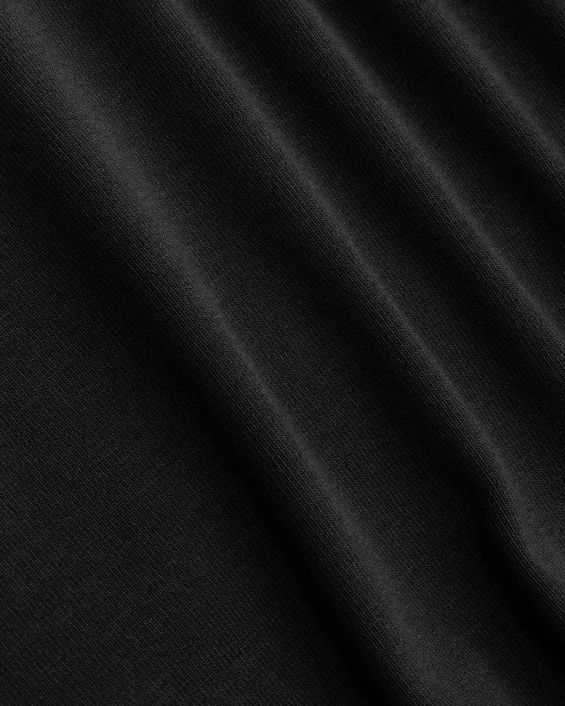 Close view of Black sleeveless crop top with ruched detailing, perfect for curve and plus sizes