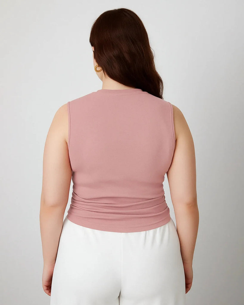 Back view of a women wearing Pink sleeveless crop top with side ruching, designed for comfort and movement, perfect for a versatile wardrobe