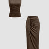 Two pieces of women's clothing: a brown sleeveless ruched top and a brown midi skirt set.