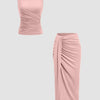 Front view of Rose pink co-ord set with sleeveless ruched top and matching midi skirt, featuring a fitted silhouette and soft draped detailing