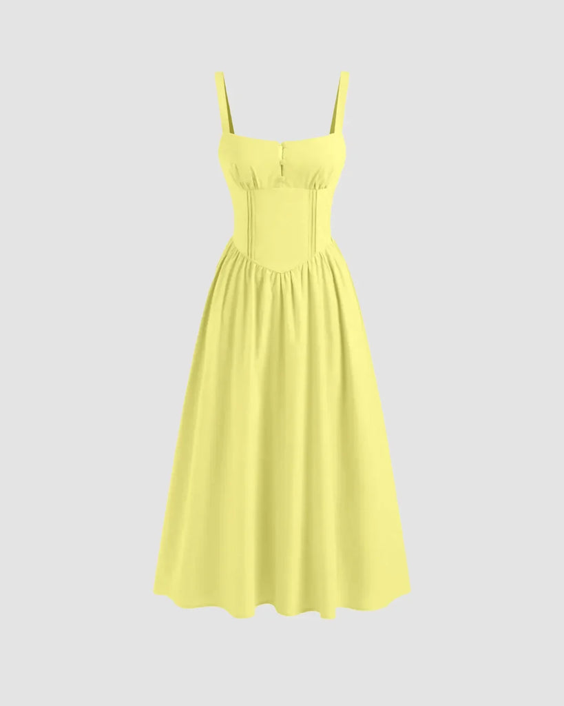 Yellow sleeveless midi dress featuring a square neckline and tie straps.