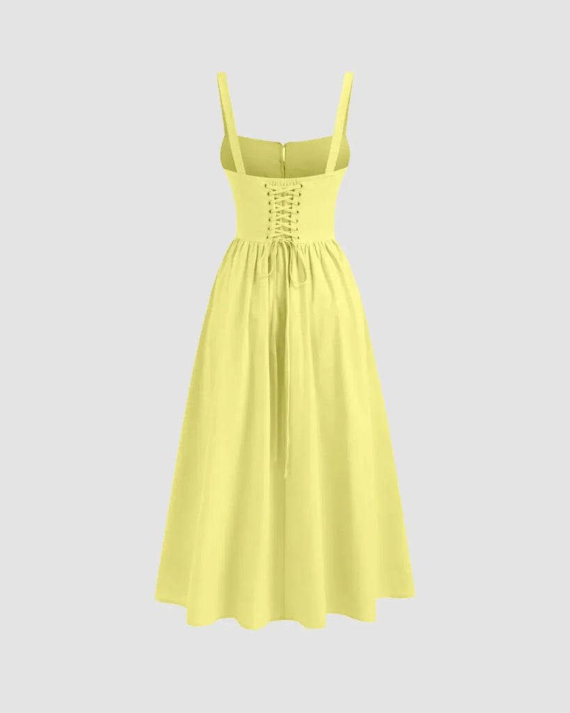 Back view of a Yellow sleeveless midi dress featuring a square neckline and tie straps.