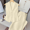 Front view of beige co-ord set with sleeveless V-neck vest top and high-waisted A-line pants, featuring a tailored fit and clean structured look