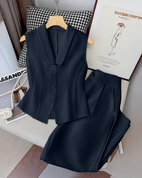 Front view of navy blue vest style blazer top with button front paired with high waist pants, stylish blazer pants set.