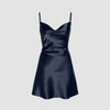 Navy silk slip dress with a smocked back strap, featuring a midi length and elegant silhouette.