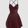 burgundy spaghetti strap dress featuring a low cut and cowl neck design, showcasing a backless style in wine