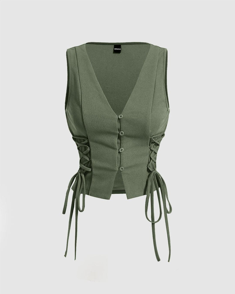 Women's green crop tank top with a tie around the waist and black side straps, featuring a solid color design.