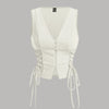 Milky white crop tank top with cross tie straps and lace-up sides, featuring a button-down detail for a stylish look.
