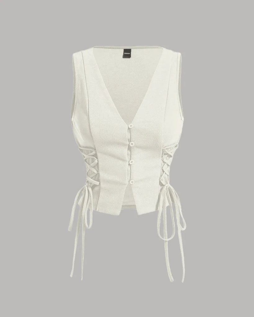 Milky white crop tank top with cross tie straps and lace-up sides, featuring a button-down detail for a stylish look.