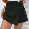 Front view of Black solid color wrap mini skort with knot side tie detail, featuring a sleek fitted and flattering silhouette