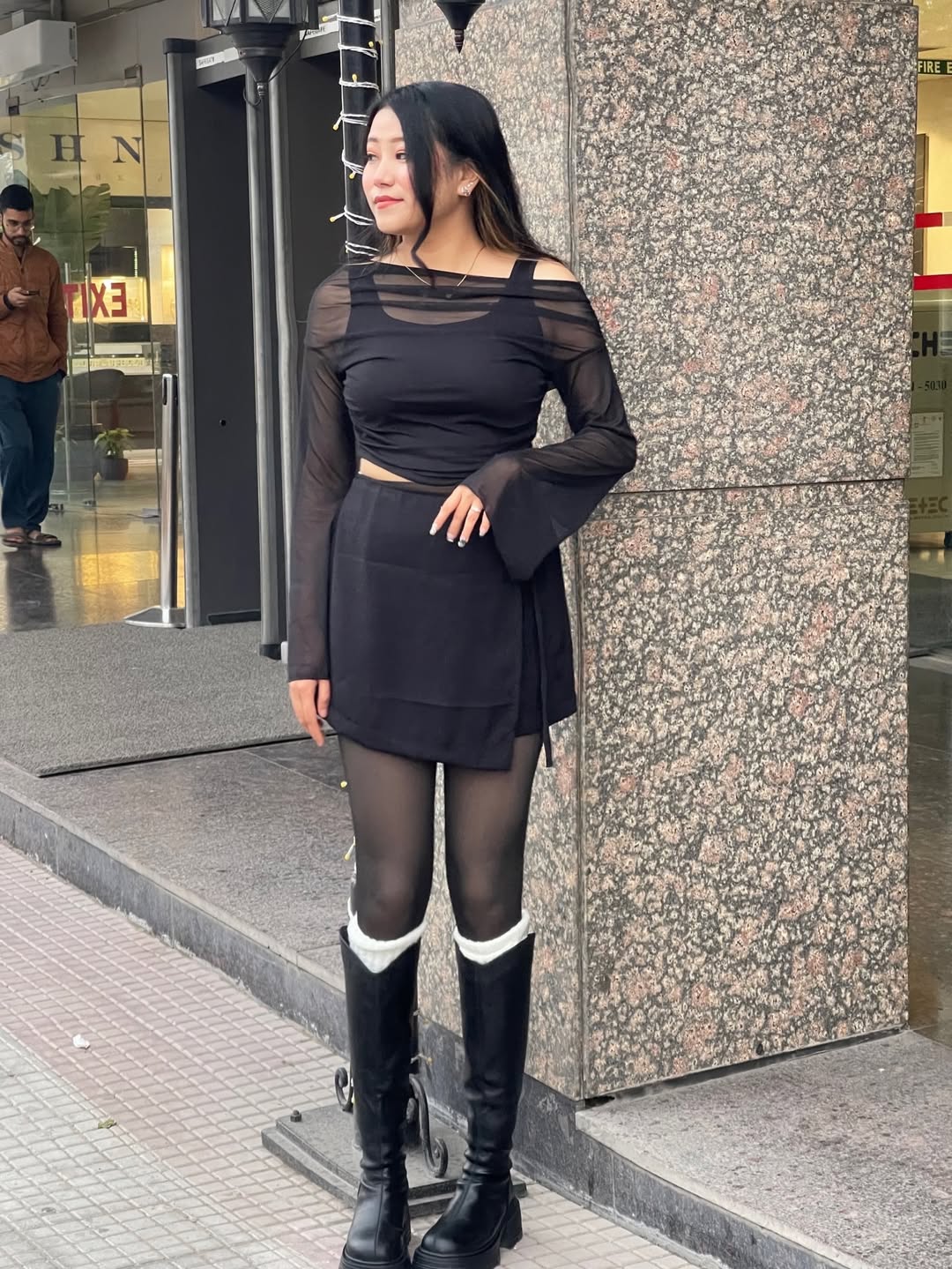 Customer photo 1 of Solid Color Knot Side Wrap Mini Skirt in Black