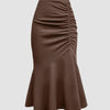 A stylish brown skirt with a ruched hem