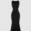 Velvet maxi dress with a sweetheart neckline, split design, and ruched knotted details, showcasing elegance and style