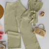 Olive green two-piece co-ord set with a strappy button-down top and high-waist straight pants, styled with gold accessories flat lay