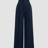 Front view of navy blue high-waisted wide-leg pants with button detail, featuring a relaxed fit and clean silhouette for a polished everyday look
