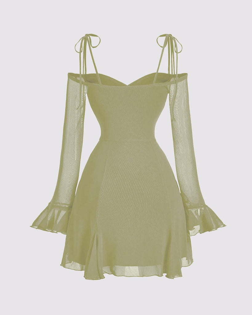Back of Herbal green dress with ruffles on the shoulders and a v-neck, featuring a bow tie at the waist.