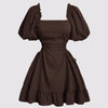 Brown dress with ruffled sleeves and lace-up side detail, showcasing a stylish and elegant design in chocolate brown