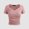 Solid ribbed dusty pink women's top with a V-neck and short sleeves, designed for a stylish and comfortable fit.