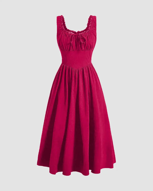 A hot pink dress with ruffled shoulders and a ruched bust design.