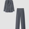 Solid dark grey tailored blazer and straight trousers co-ord set displayed on a neutral background.