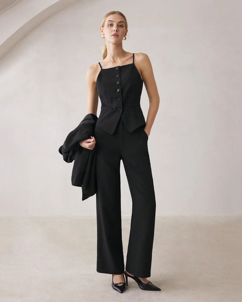 A model wearing black matching set featuring a spaghetti strap button top and straight-leg trousers.
