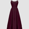 Burgundy spaghetti strap fit and flare sleeveless midi dress displayed on a mannequin against a neutral background.

