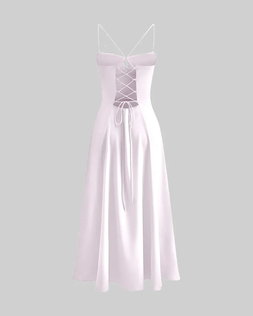 Back view of a Baby pink spaghetti strap midi dress featuring a ruched bust and tie-front detail for a delicate, feminine touch.