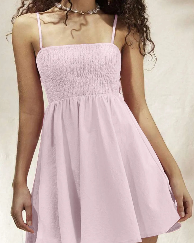 Pink spaghetti strap shift featuring a ruched bust and bodycon corset design