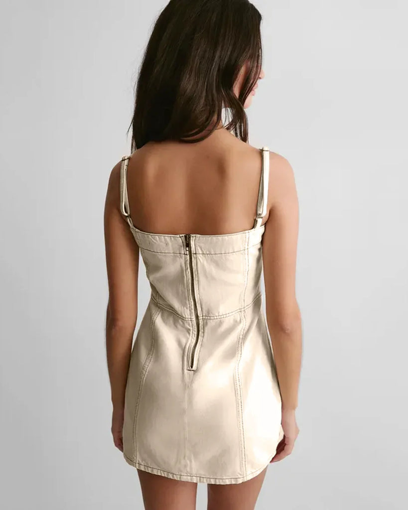 Back view of a Model in a white spaghetti strap mini dress with a square neck and side slit, showcasing a stylish and elegant look.