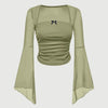 Front view of Green long sleeve top with bell sleeves and square neck, featuring a decorative bow detail.