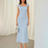 Model wearing a light blue square neck cap sleeve bodycon midi dress, showcasing a stylish and elegant look.