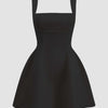 Black sleeveless mini dress with a square neckline and fit-and-flare design.