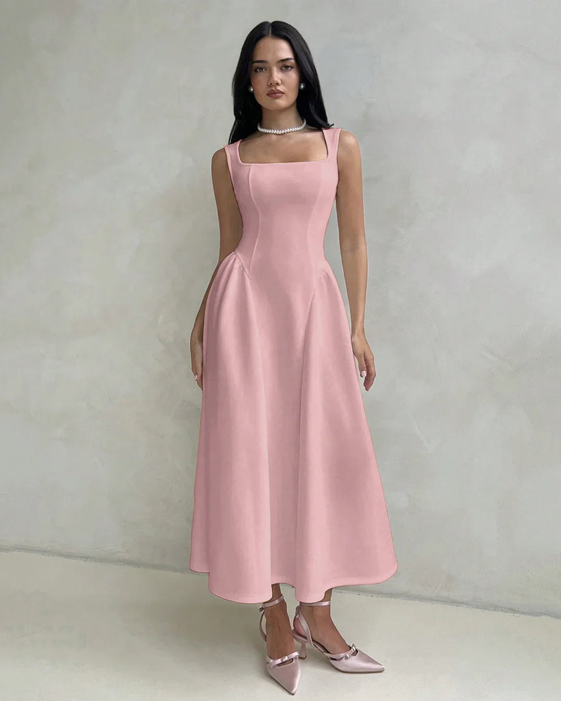 Model in a dusty pink sleeveless fit and flare midi dress featuring a square neckline.