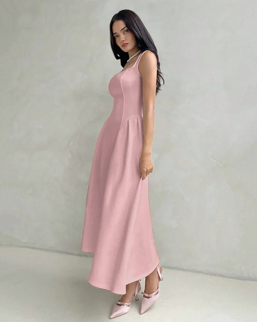 Model in a dusty pink sleeveless fit and flare midi dress featuring a square neckline.