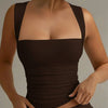 Women wearing of Brown cropped tank top with square neckline and slim fit, featuring a sleeveless design and smooth fitted silhouette