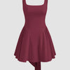 Maroon mini dress with a square neckline, featuring ruffles and pleats, designed for a stylish and elegant look.
