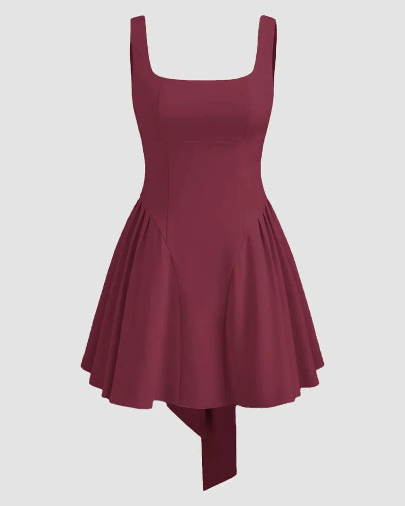 Maroon mini dress with a square neckline, featuring ruffles and pleats, designed for a stylish and elegant look.