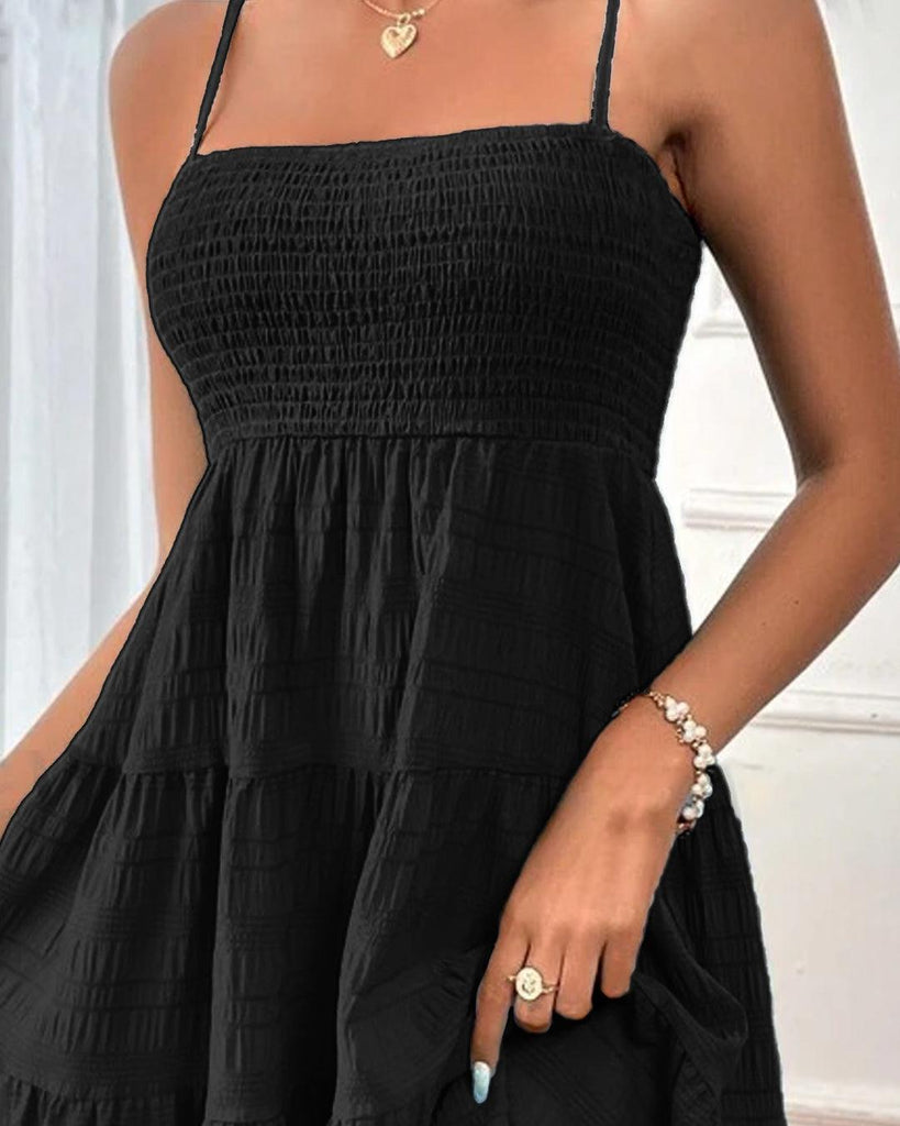 A black beach dress featuring a square neckline and delicate spaghetti straps for a breezy, effortless look.