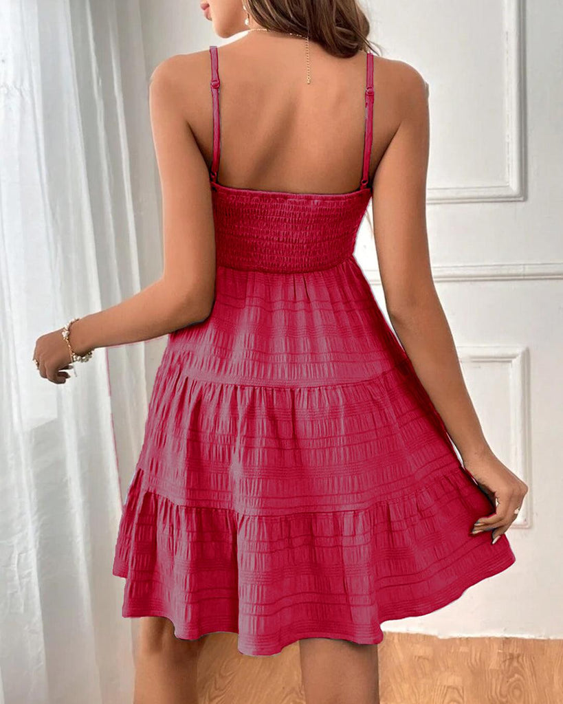 Back of a pink beach dress featuring a square neckline and spaghetti straps for a breezy, effortless look. 