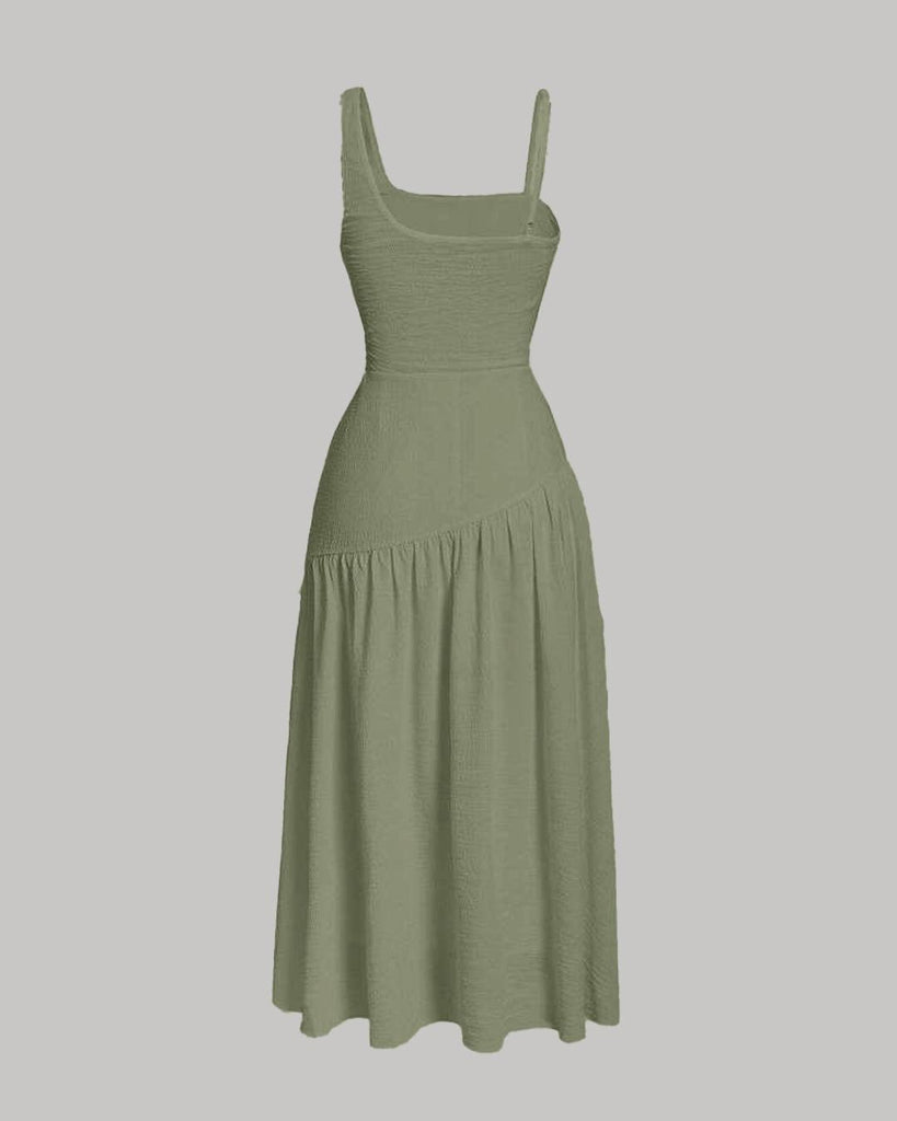 Back view of a green dress featuring a square neckline, spaghetti straps, and ruched side detailing for a sculpted, modern silhouette.