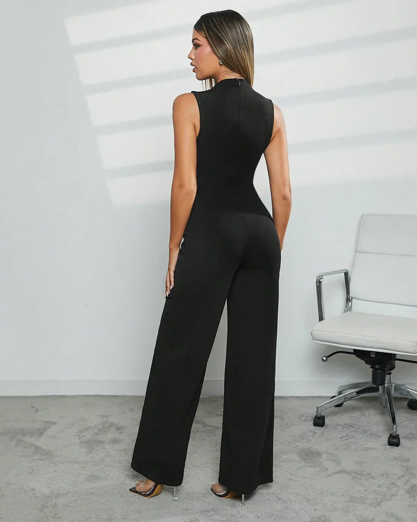 Back view of a Model wearing a black square neck wide leg jumpsuit, showcasing a stylish and modern outfit.